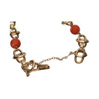 Pulsera en oro amarillo con bolas de coral.