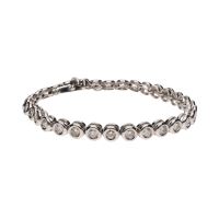 Pulsera riviere en oro blanco con brillantes en chatón.