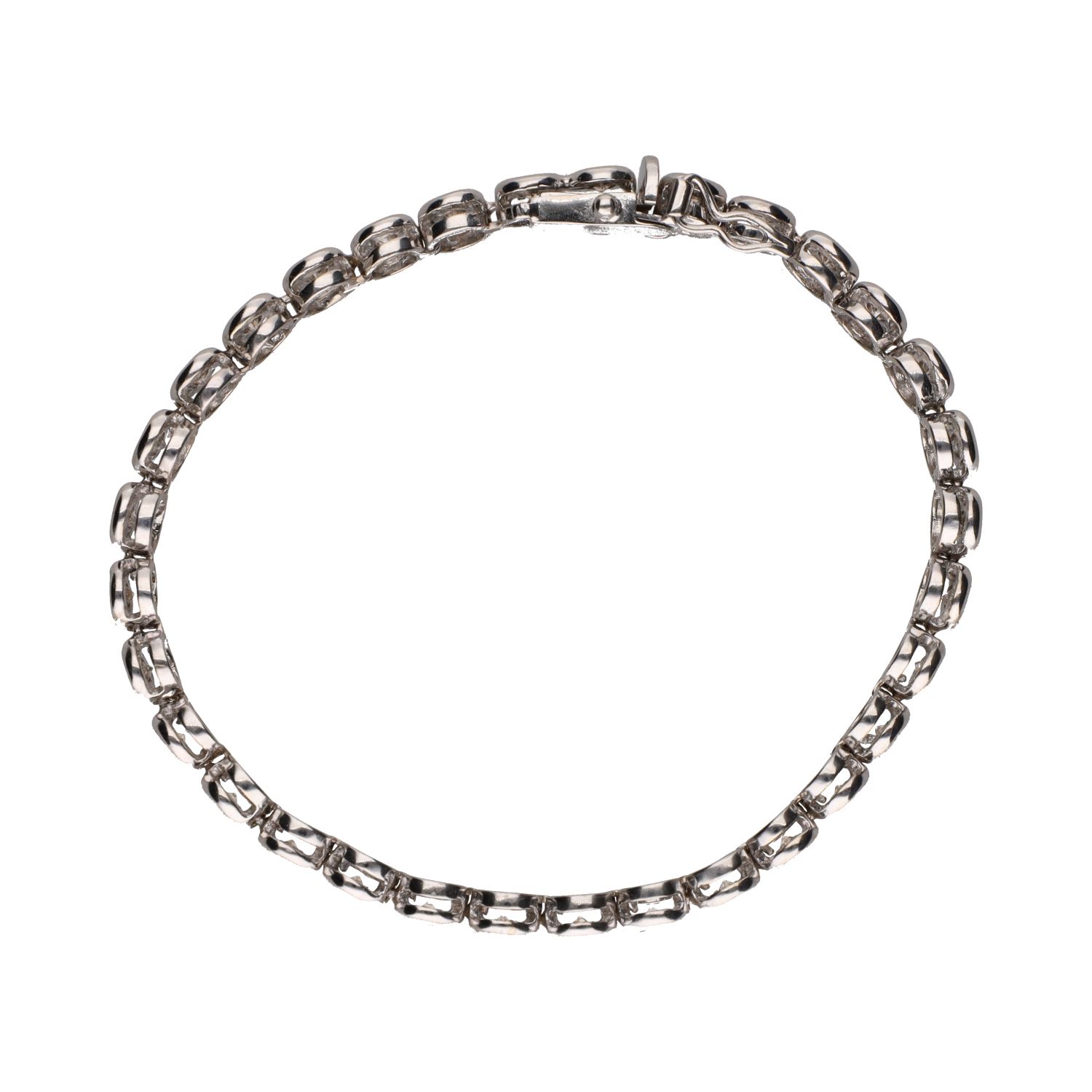 Pulsera riviere en oro blanco con brillantes en chatón.