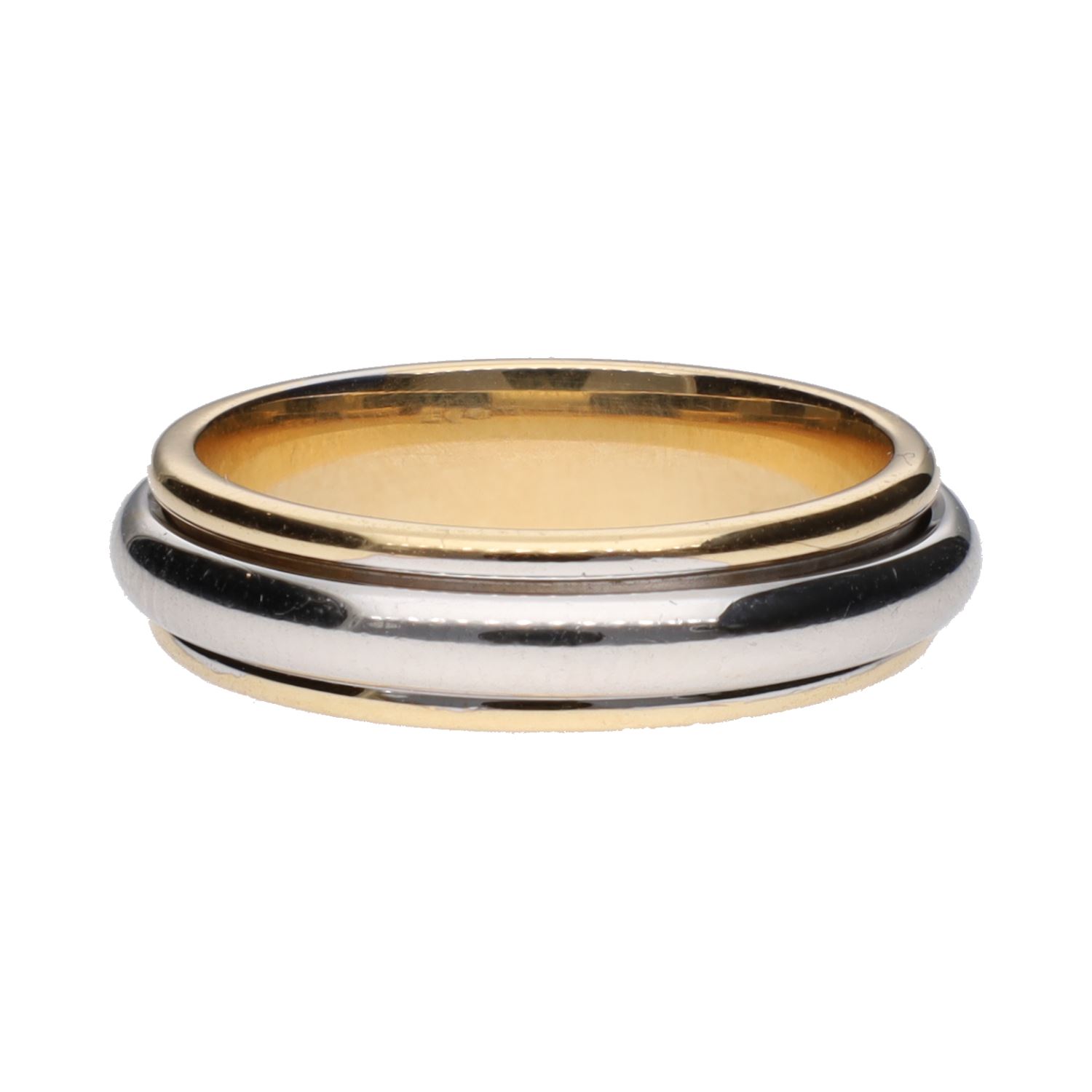 Sortija en oro amarillo con aro giratorio en oro blanco. Talla 13.