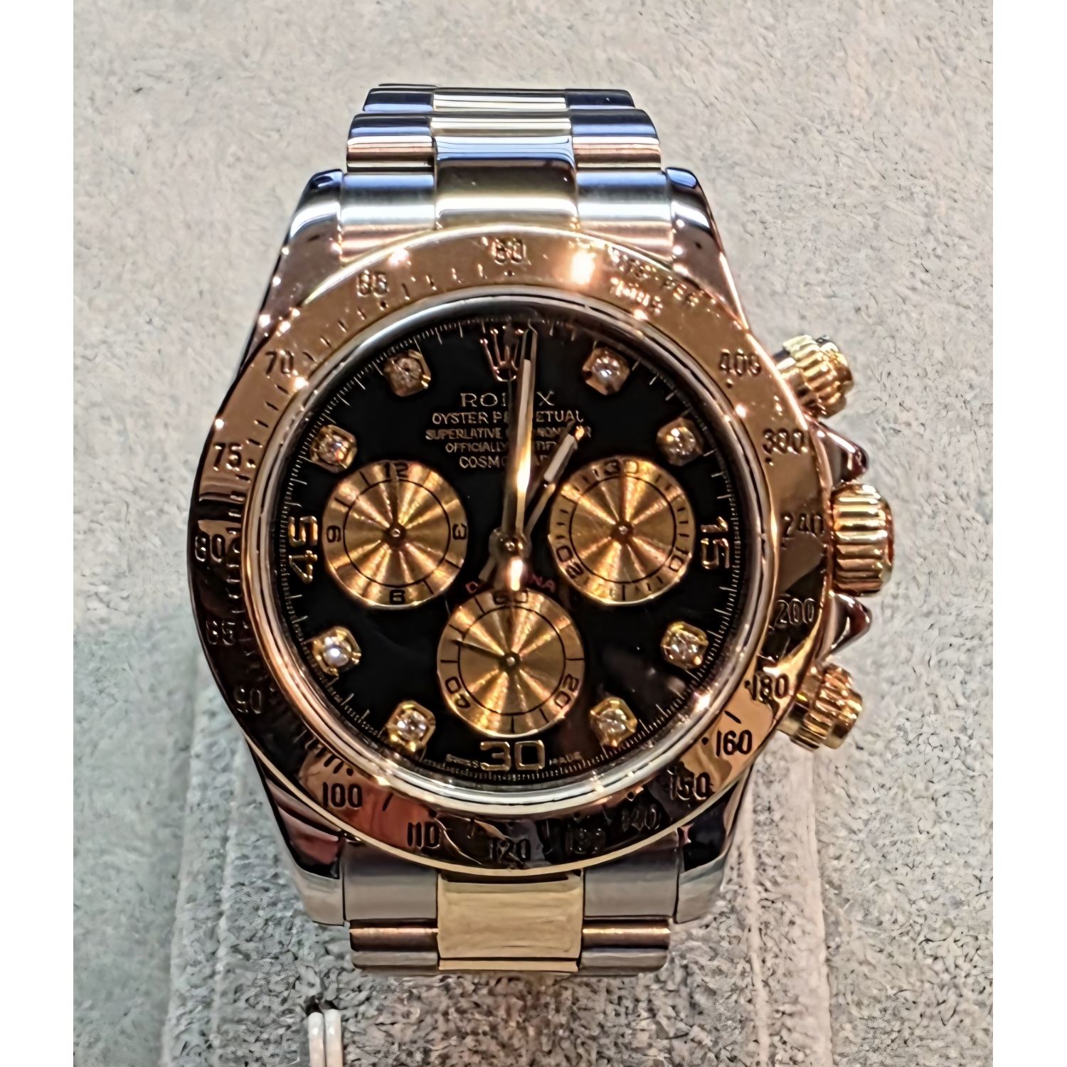 Daytona acero y oro esfera negra brillantes.   