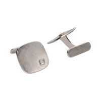 Gemelos en oro blanco con brillantes.