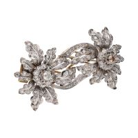 Broche doble clip en oro amarillo y oro blanco con diamantes.