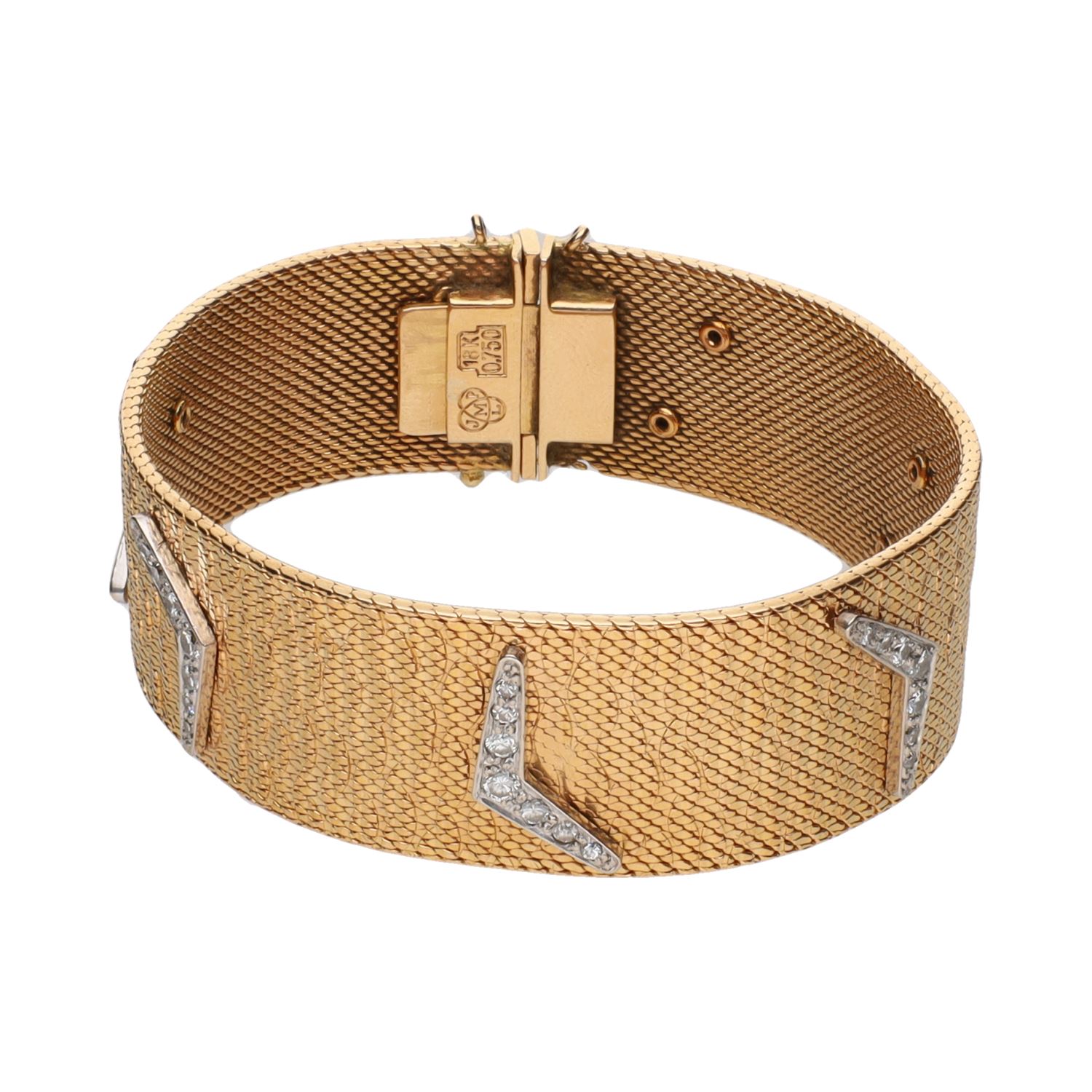 Pulsera en oro amarillo con brillantes.