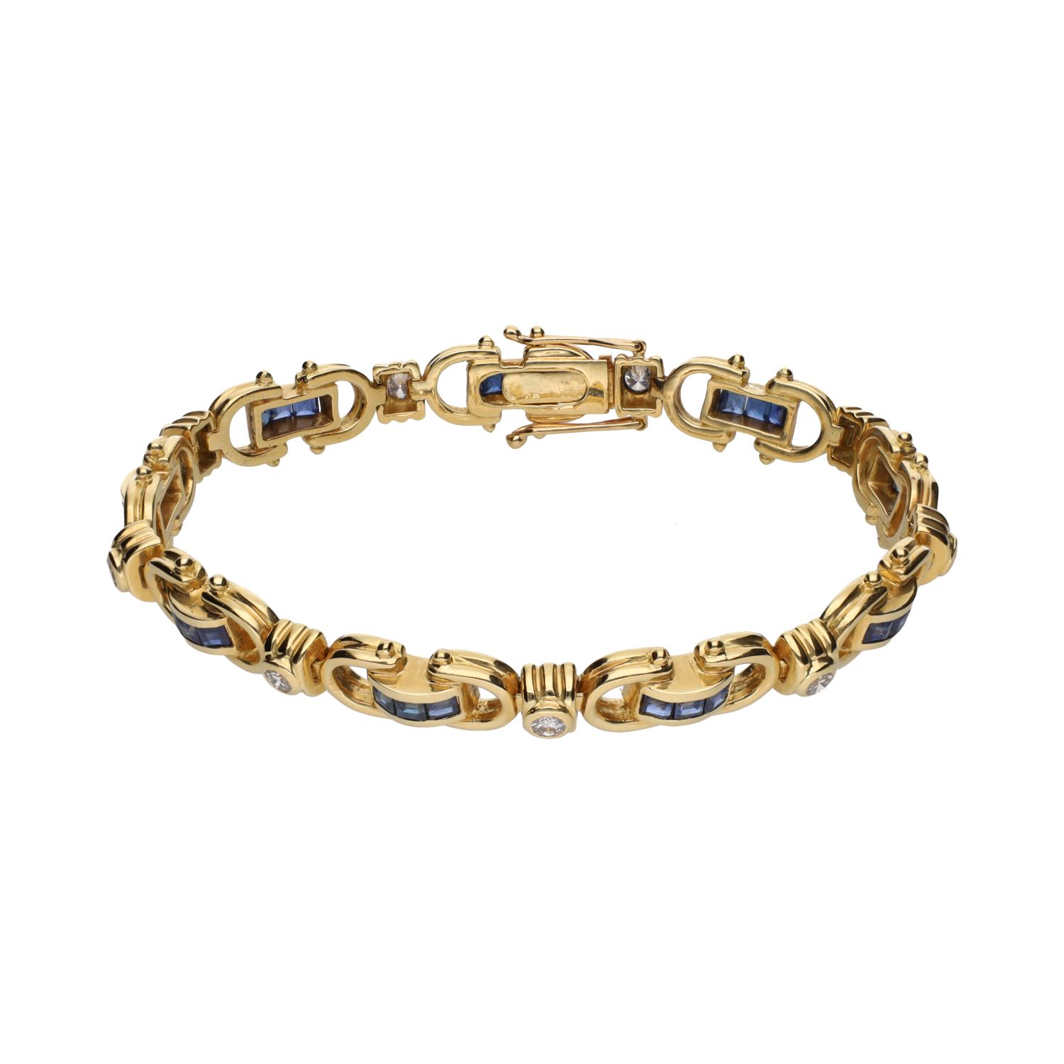 Pulsera en oro amarillo con zafiros y brillantes.