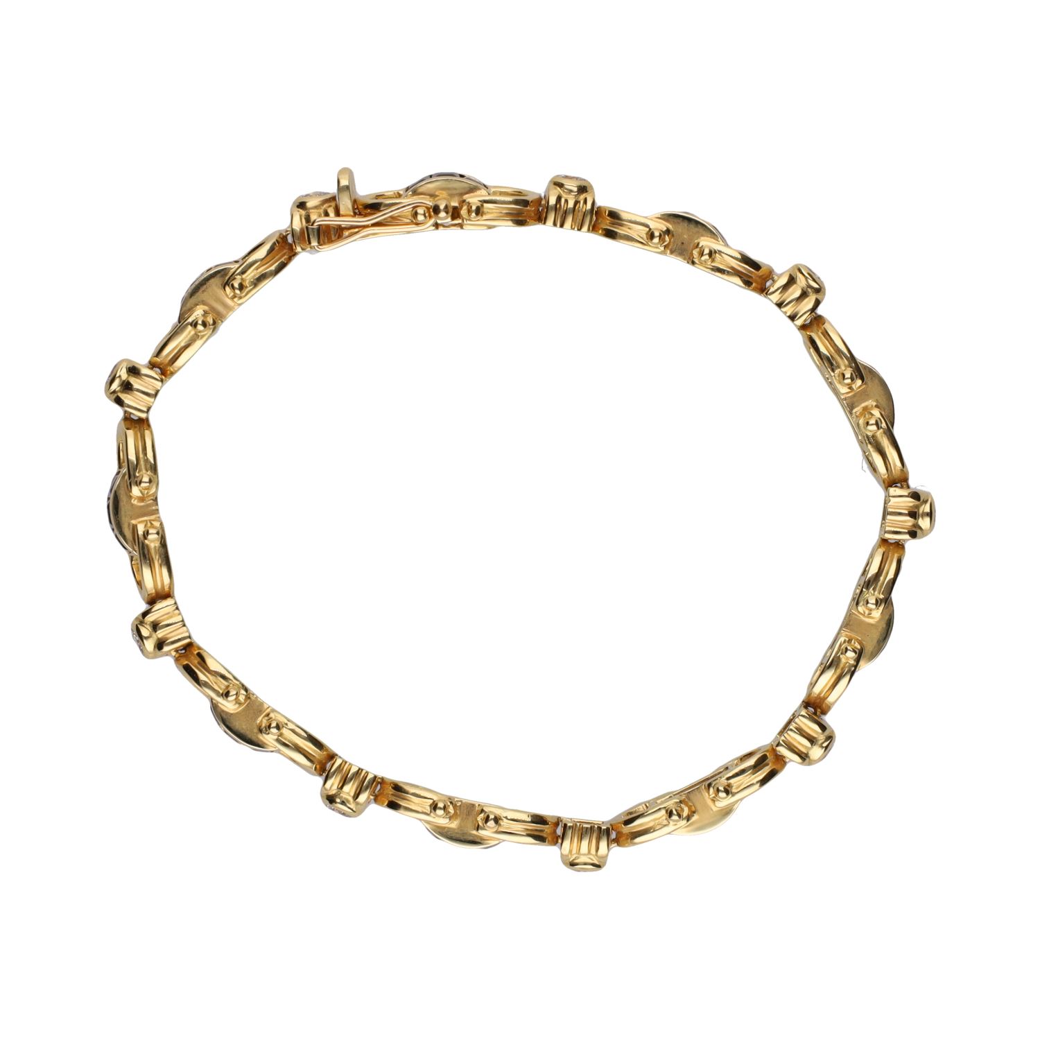 Pulsera en oro amarillo con zafiros y brillantes.