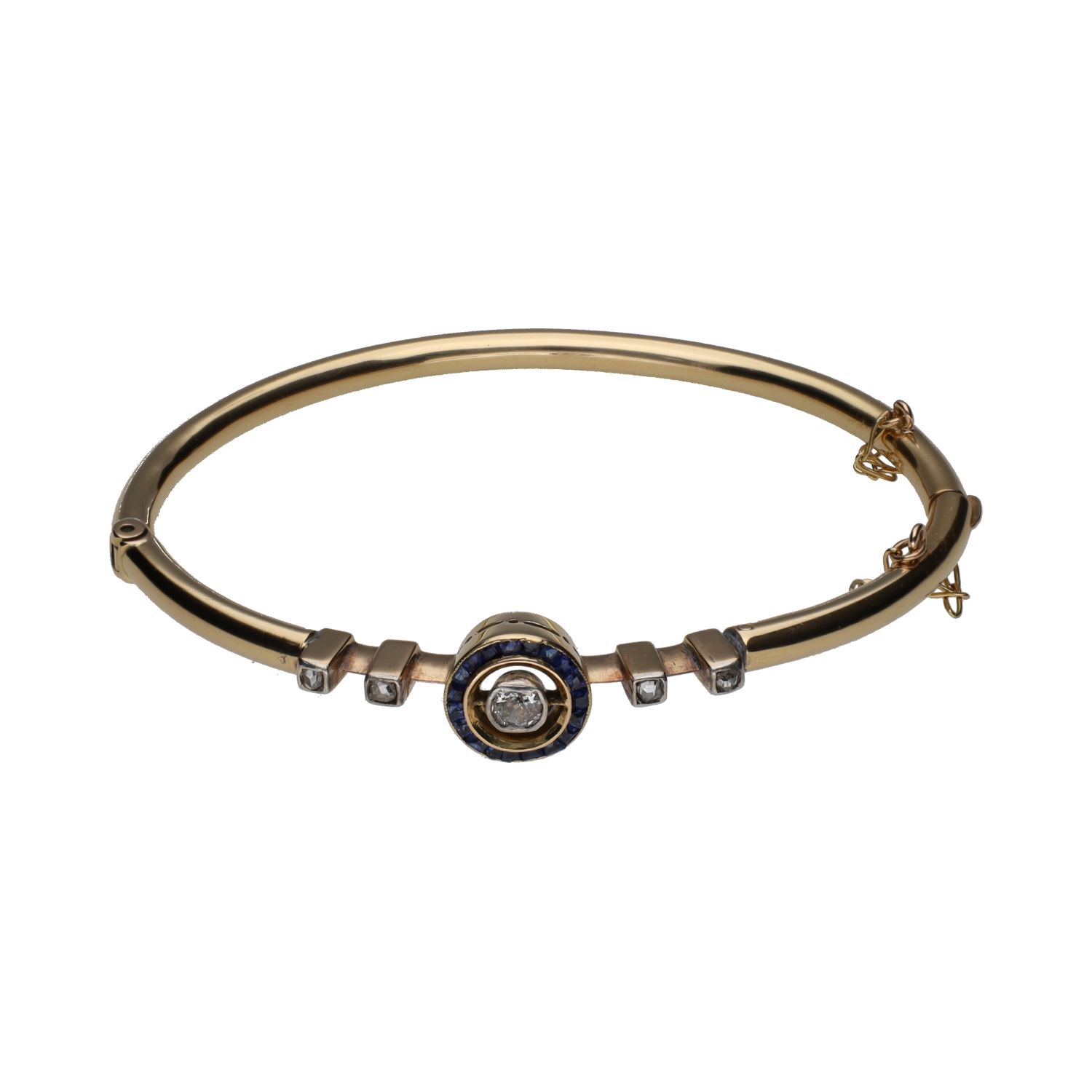 Pulsera rígida antigua en oro amarillo con zafiros y diamantes.