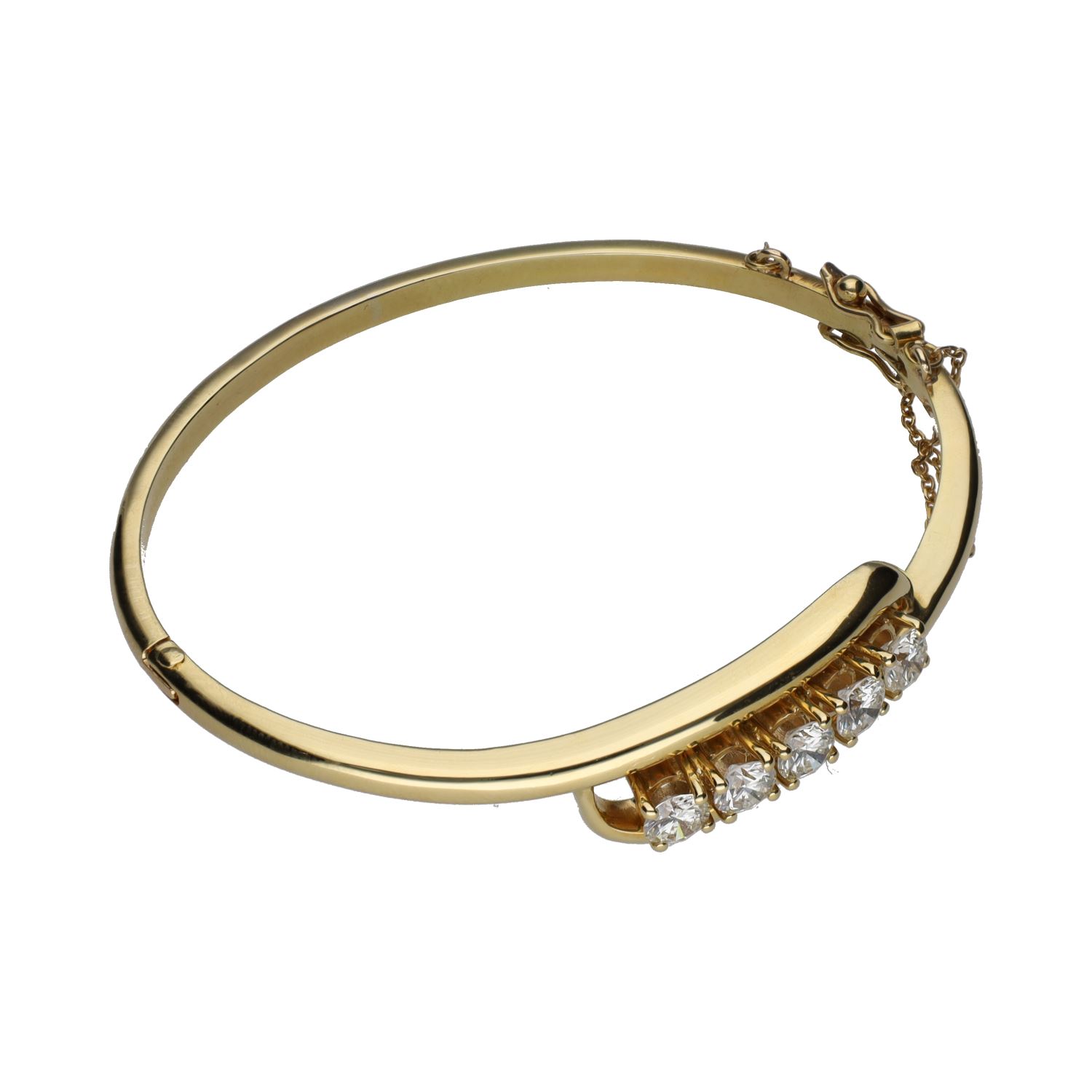 Pulsera rígida en oro amarillo con cinco brillantes.