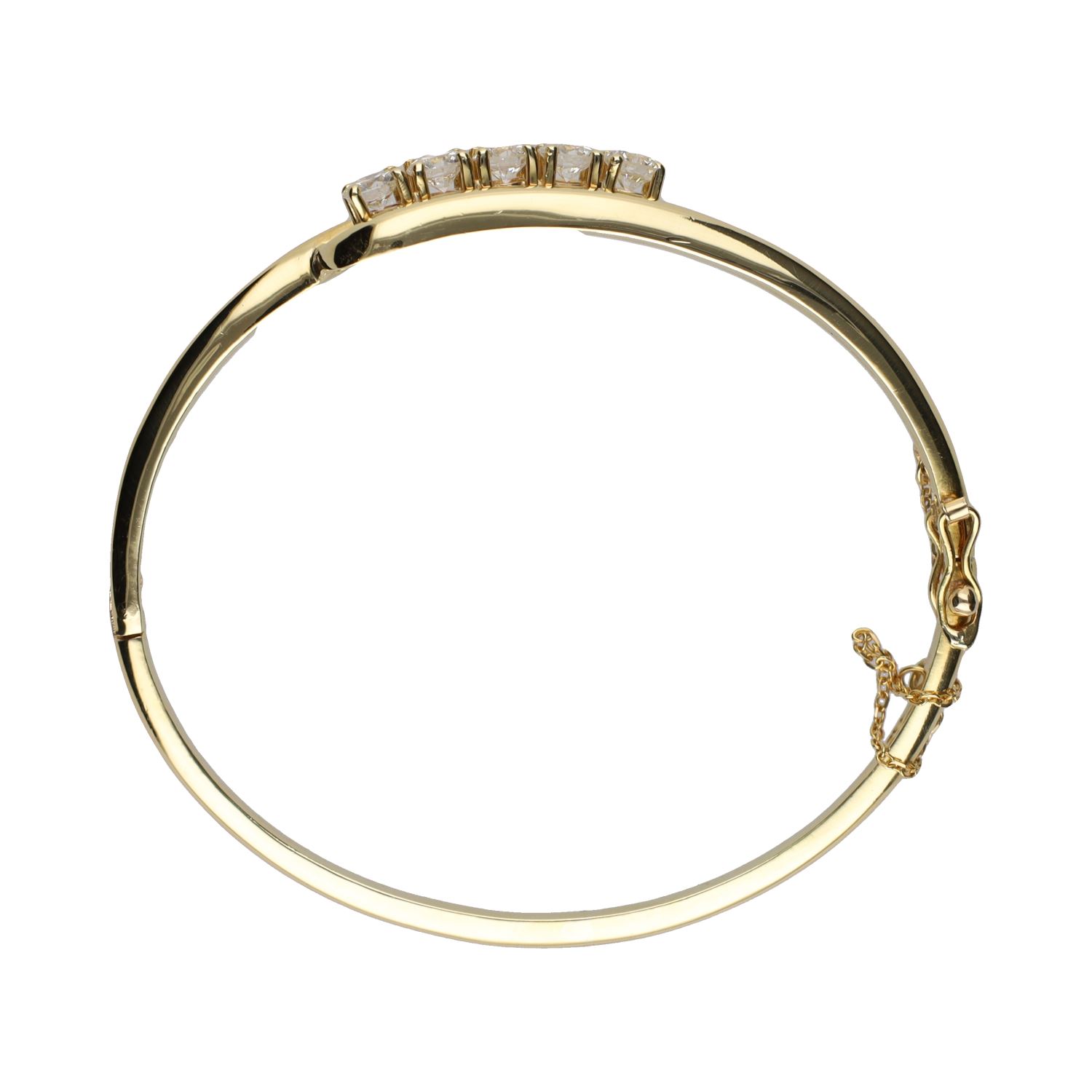 Pulsera rígida en oro amarillo con cinco brillantes.