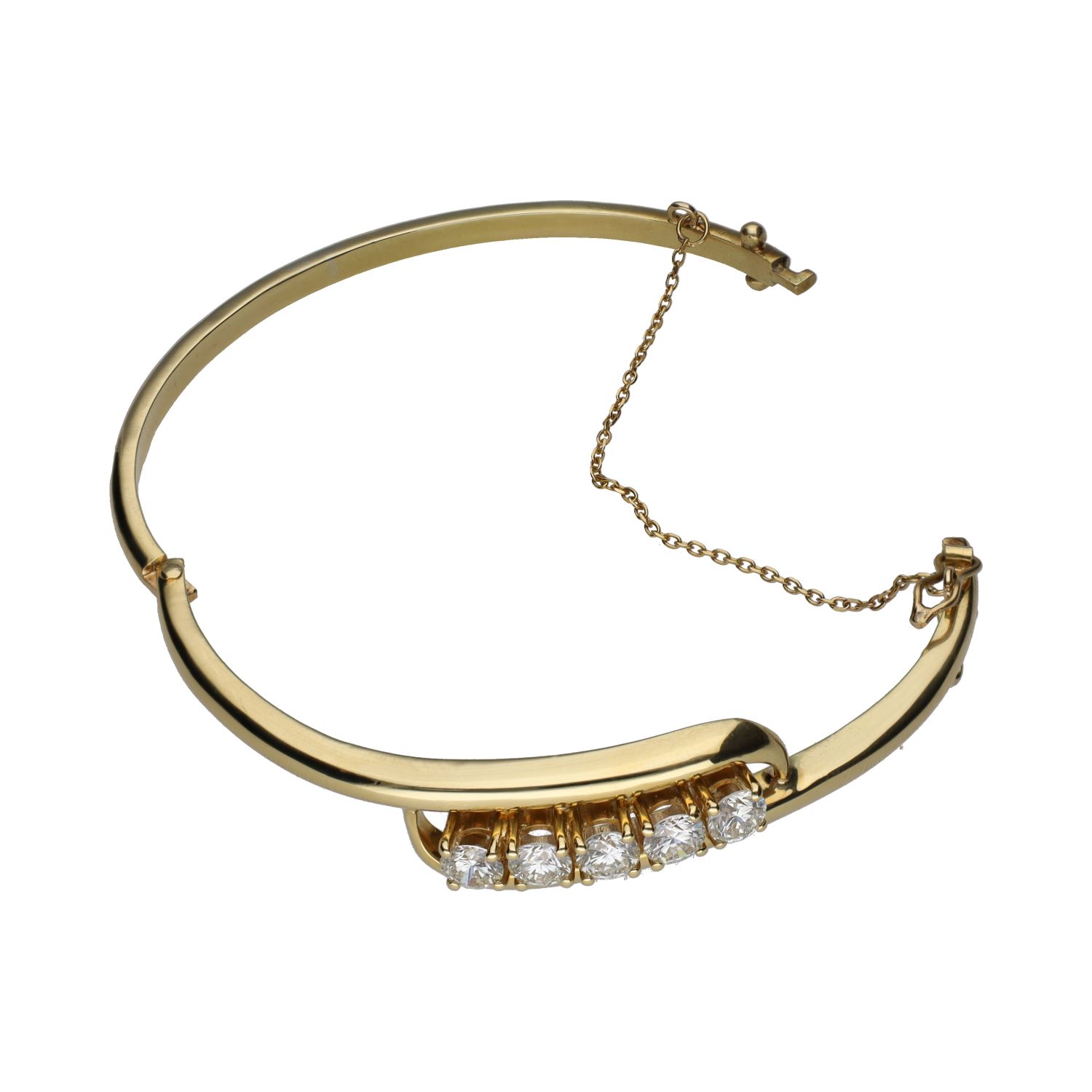 Pulsera rígida en oro amarillo con cinco brillantes.